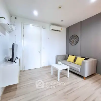 Modern living room with sleek design and cozy seating area