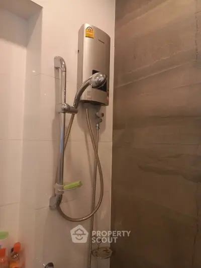 Modern bathroom with sleek shower and water heater installation