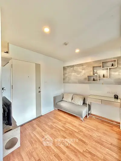 Modern living room with stylish decor and wooden flooring