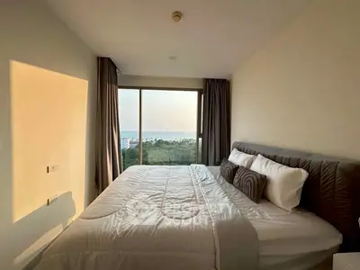 Cozy bedroom with stunning ocean view and modern decor