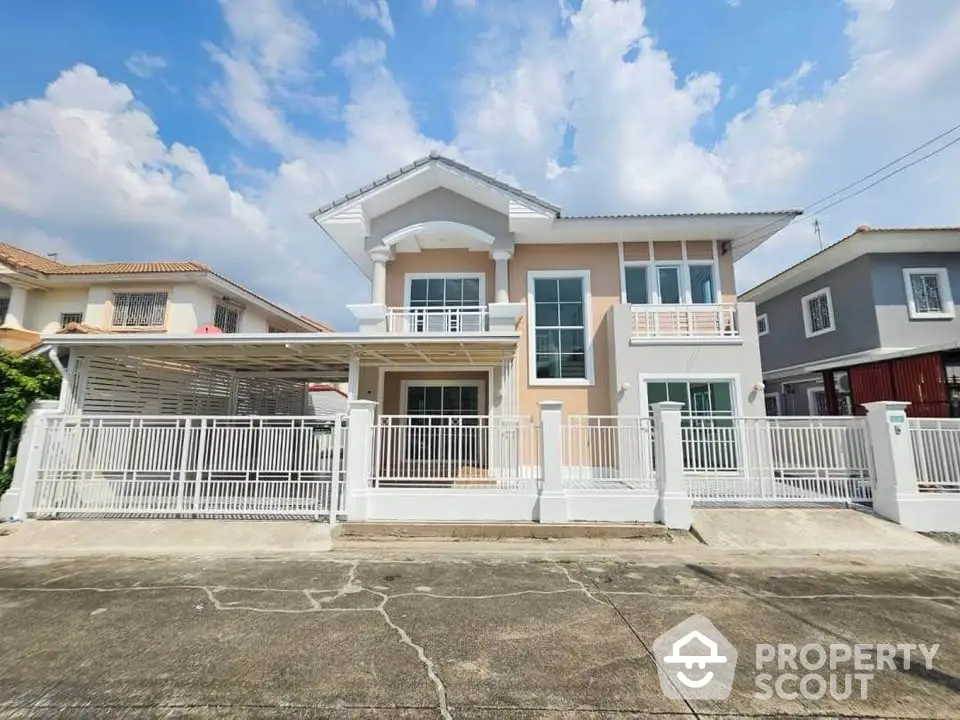 Stunning two-story house with modern design and spacious balcony in a serene neighborhood.