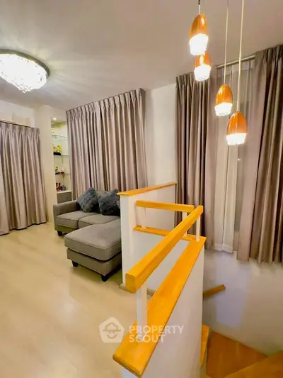 Modern living room with stylish lighting and cozy seating area