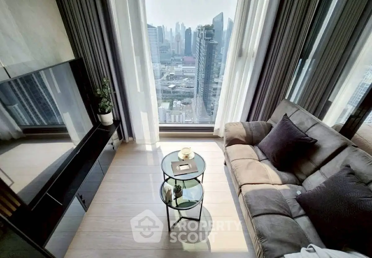 Luxurious high-rise living room with stunning city view and modern decor.
