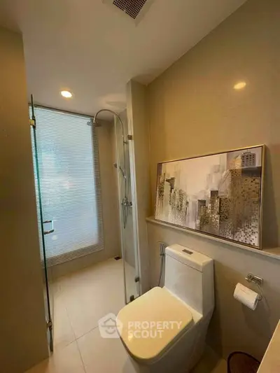 Modern bathroom with sleek design and glass shower enclosure