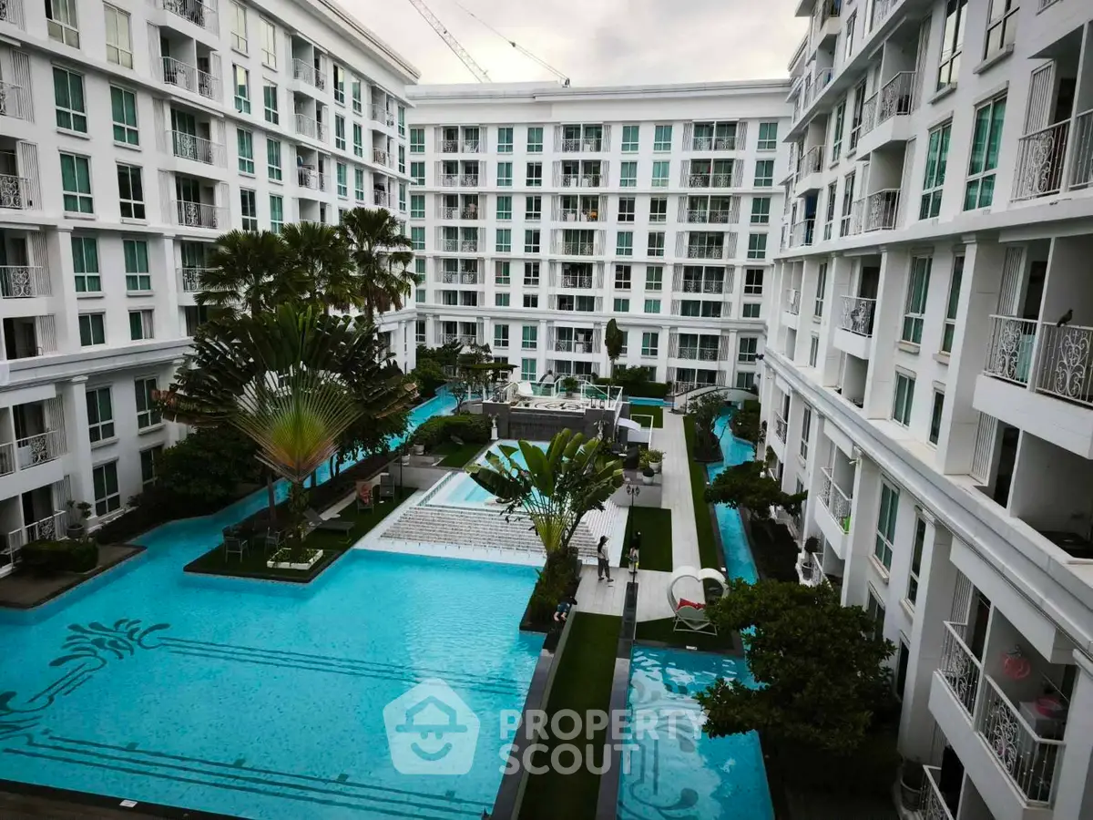 Luxurious apartment complex with stunning pool and lush landscaping