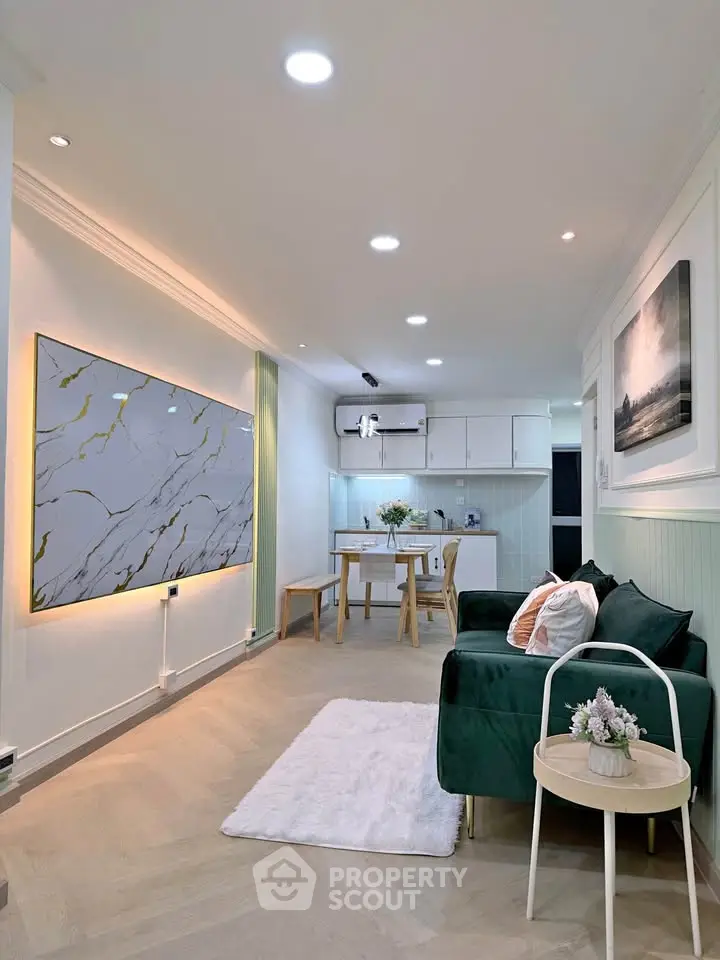 Modern living room with elegant decor and open kitchen layout