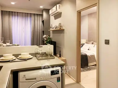 Modern apartment interior with stylish kitchen and cozy bedroom view.