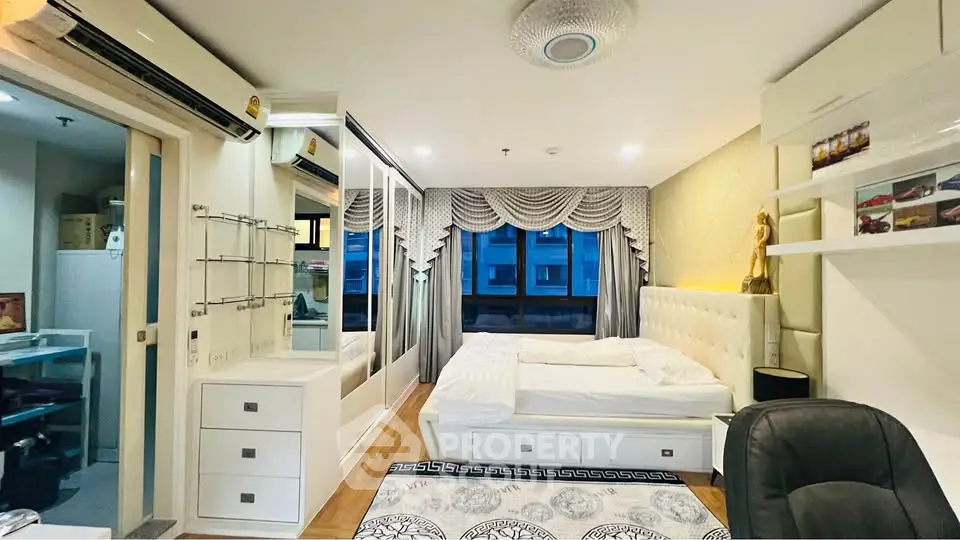 Luxurious modern bedroom with elegant decor and ample natural light