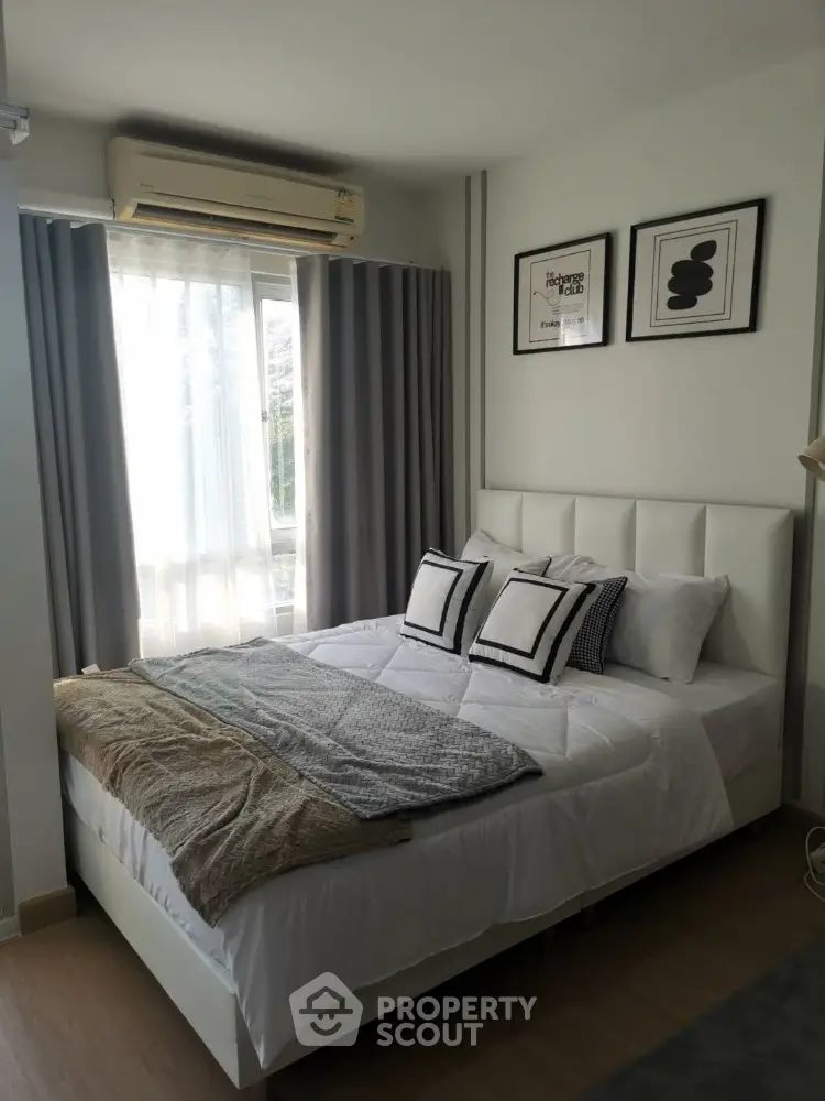Cozy modern bedroom with stylish decor and natural light