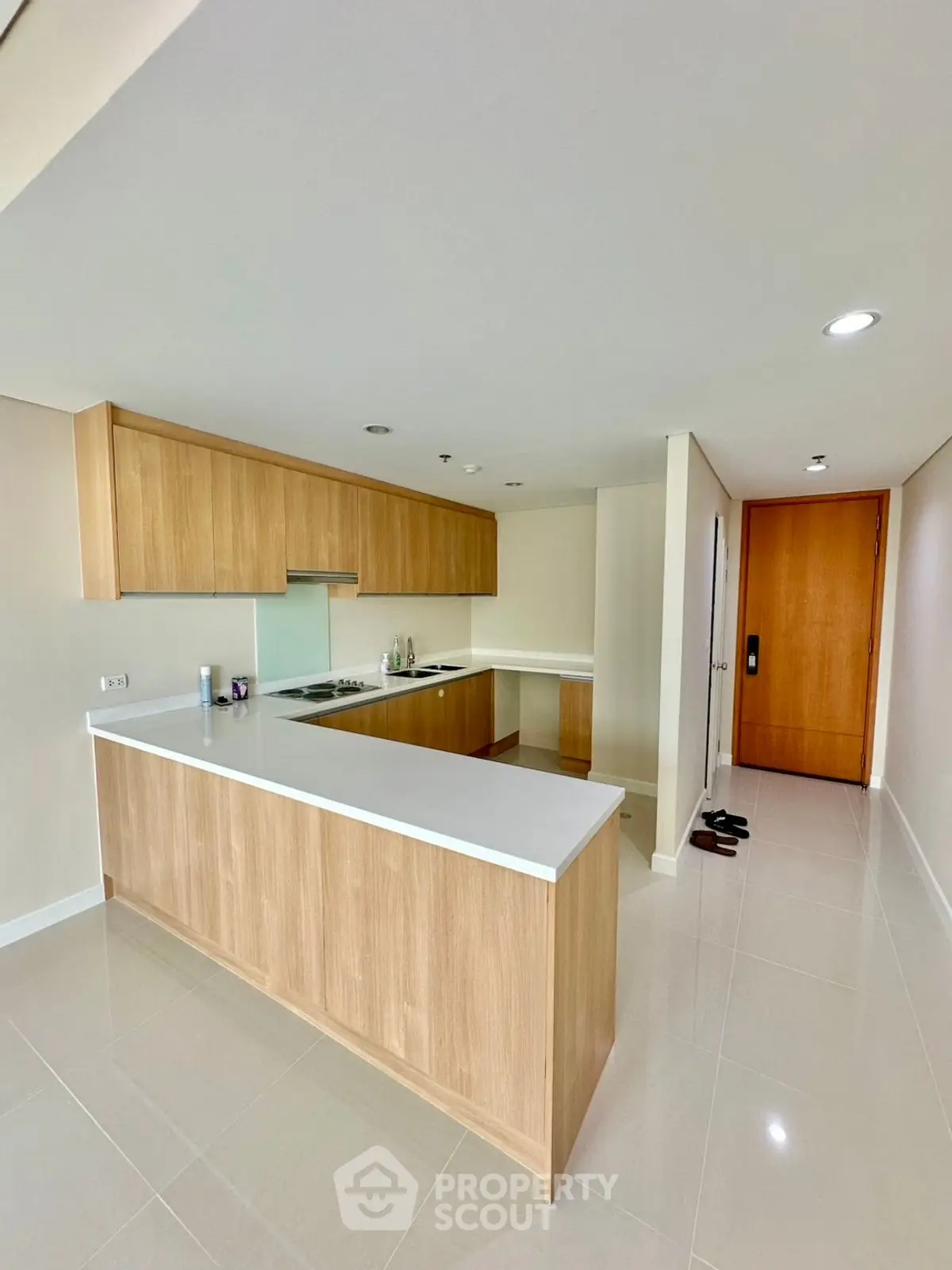 Modern kitchen with sleek wooden cabinetry and open layout design
