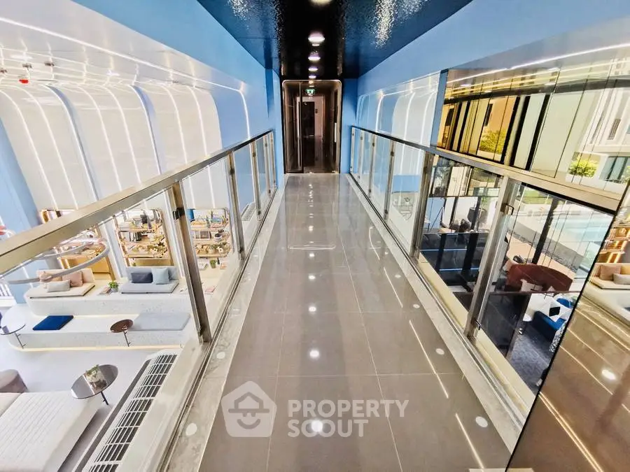 Modern corridor with glass railings and sleek design in luxury building