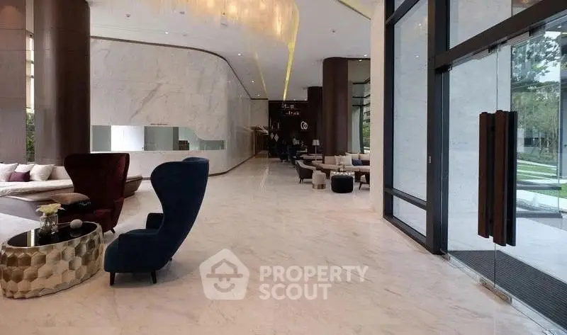Luxurious modern lobby with elegant seating and marble flooring, perfect for upscale living.