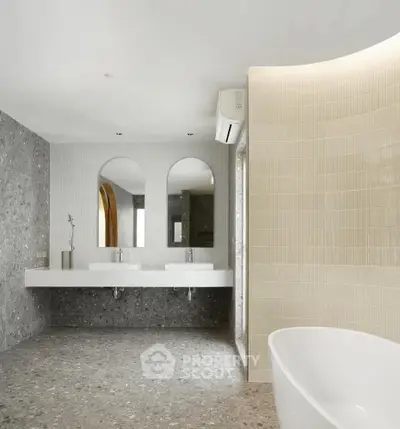 Elegant modern bathroom with dual sinks and freestanding bathtub