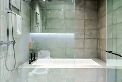 Modern bathroom with sleek design and built-in bathtub