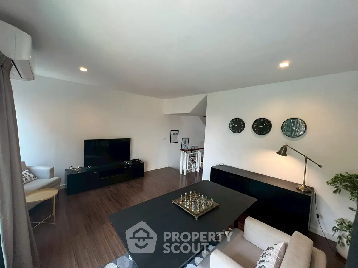 Spacious modern living room with stylish decor and hardwood floors