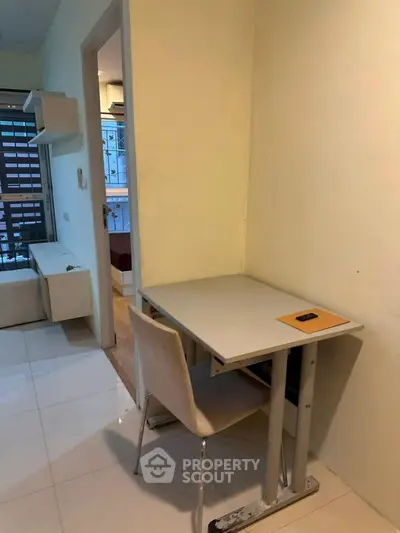 Cozy study nook in modern apartment with sleek furniture and natural light