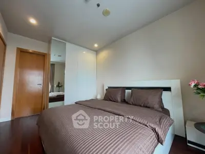 Spacious bedroom with modern decor and cozy ambiance