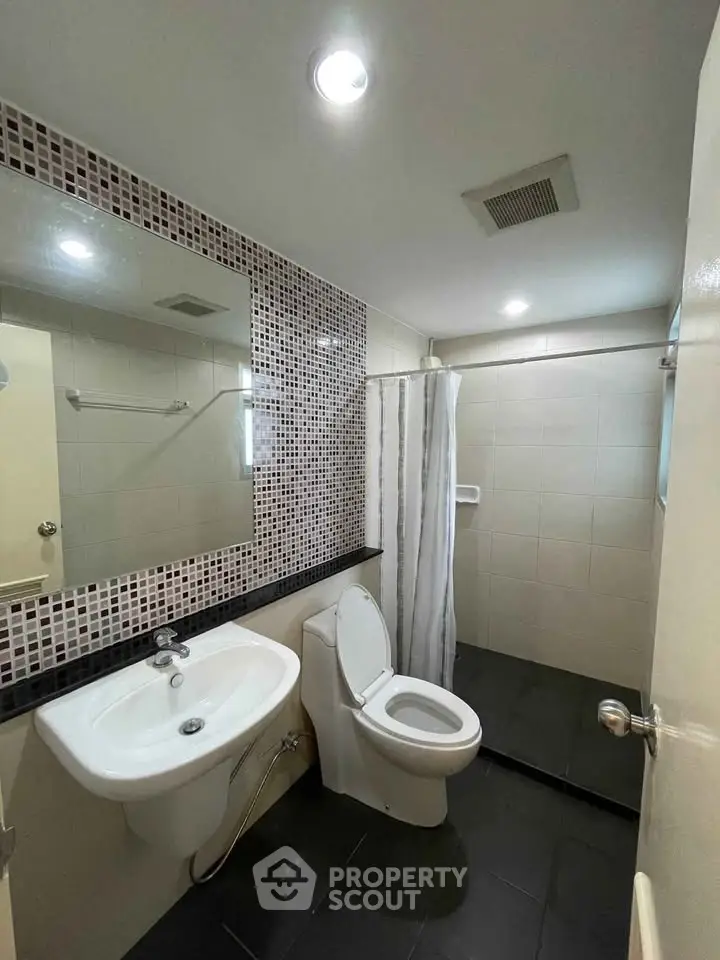 Modern bathroom with sleek fixtures and stylish tile accents