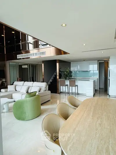 Luxurious open-plan living room with modern kitchen and elegant furnishings