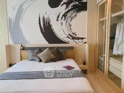 Modern bedroom with stylish decor and built-in wardrobe, featuring a minimalist design and cozy ambiance.