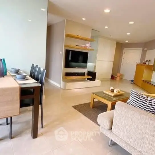 Spacious modern living room with elegant dining area and cozy seating, perfect for family gatherings.