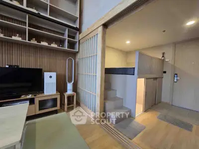 Modern Japanese-style living room with loft bed and minimalist decor