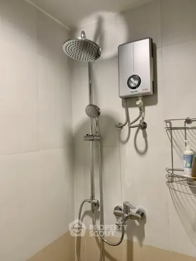 Modern bathroom with shower and water heater, sleek design for comfort and efficiency.