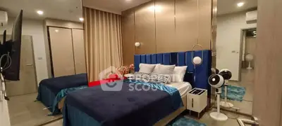 Luxurious modern bedroom with elegant decor and plush bedding in a stylish apartment.