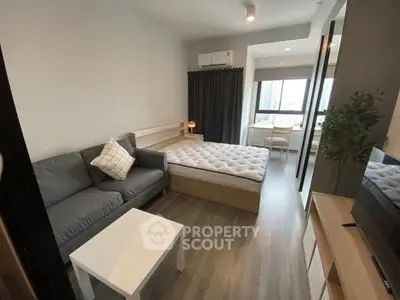 Modern studio apartment with cozy living area and stylish decor