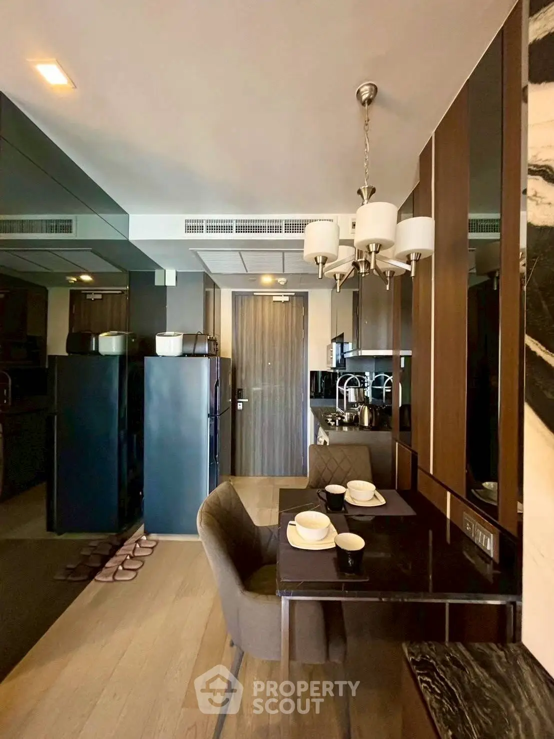 Modern kitchen with sleek design and dining area in luxury apartment