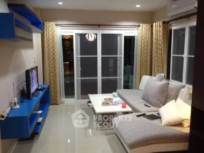 Modern living room with sleek furniture and large windows