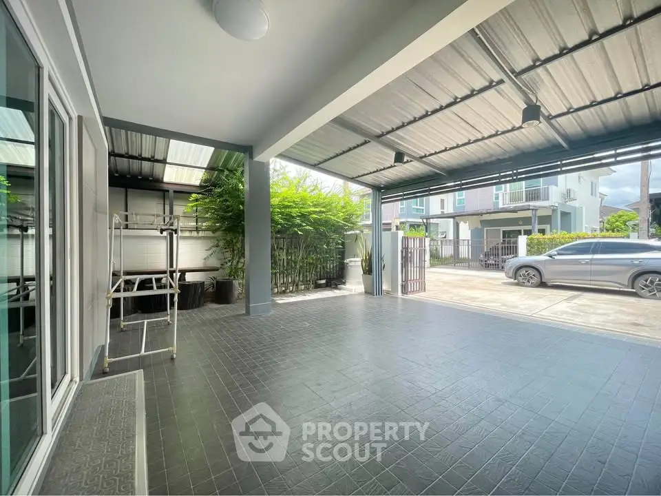 Spacious covered parking area with modern design and greenery