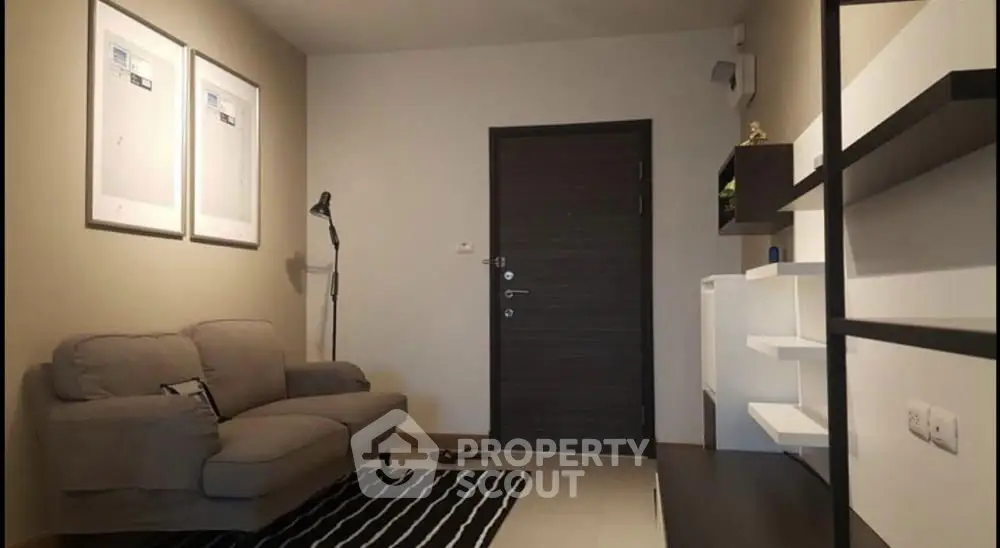 Modern living room with stylish decor and cozy sofa in a contemporary apartment.