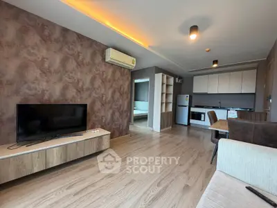 Modern open-plan living room with stylish kitchen and cozy decor