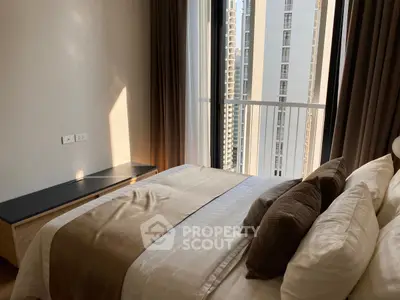 Modern bedroom with city view and elegant decor in high-rise apartment