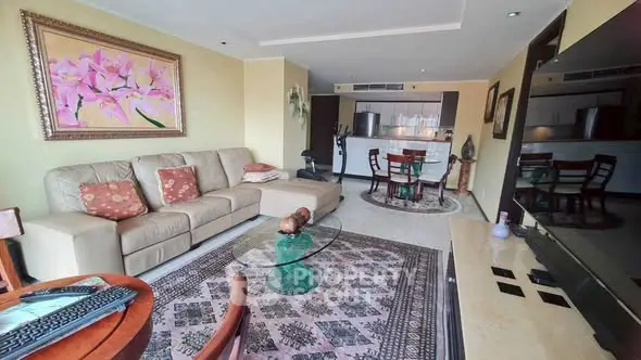 Spacious living room with elegant decor and open layout in modern apartment.