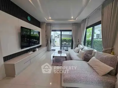 Luxurious modern living room with large windows and stylish decor