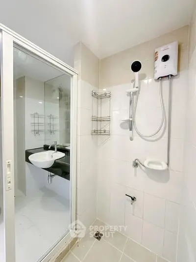 Modern bathroom with glass shower enclosure and water heater