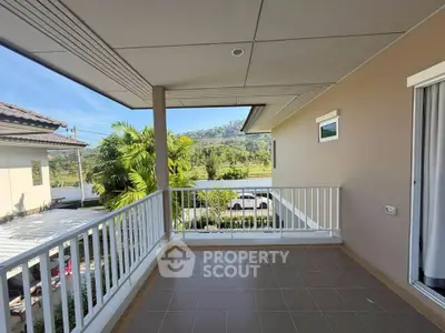 Spacious balcony with scenic mountain view in modern home
