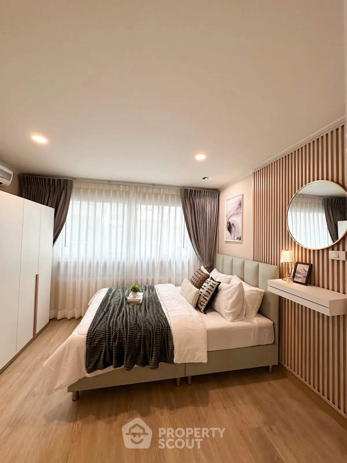 Modern bedroom with stylish decor, cozy bed, and elegant lighting in a contemporary apartment.