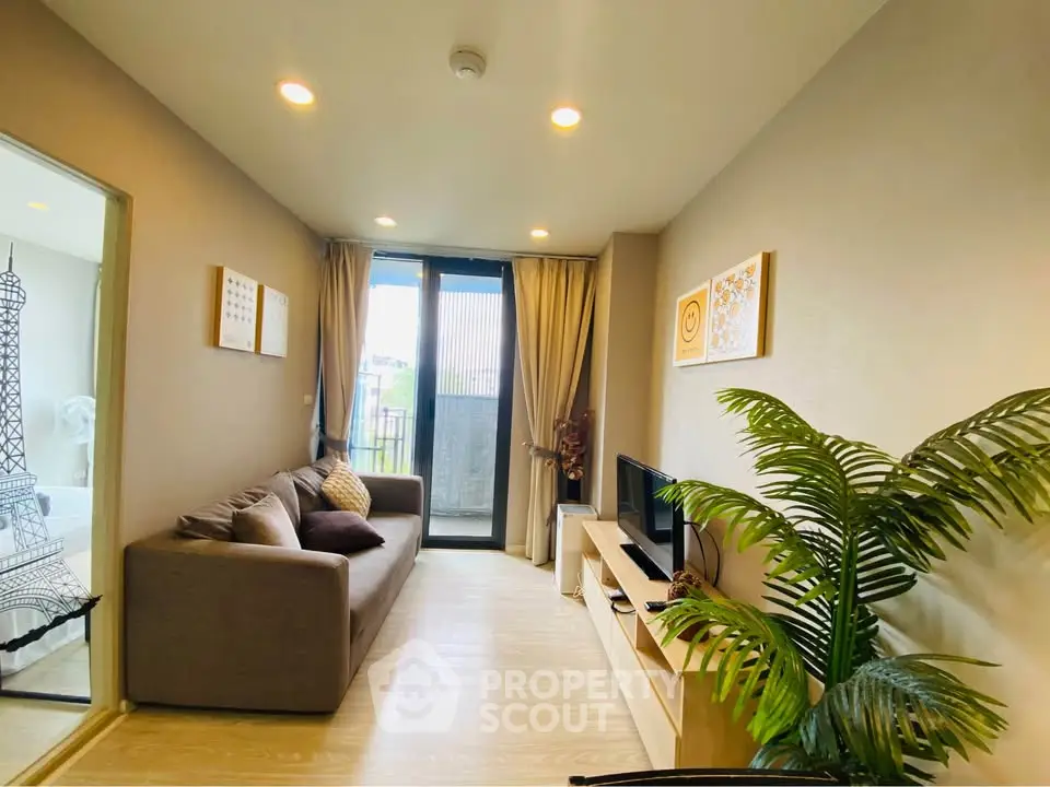 Modern living room with cozy sofa and balcony view in stylish apartment