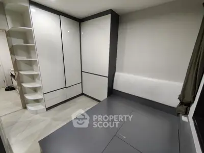 Modern minimalist bedroom with sleek built-in storage and stylish design