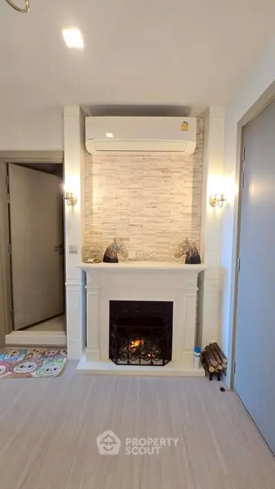 Charming living room with elegant fireplace and modern air conditioning unit.