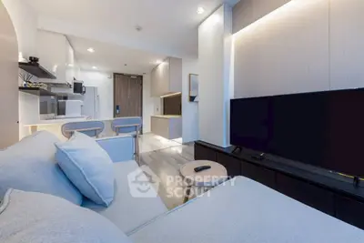Modern living room with open kitchen layout and stylish decor