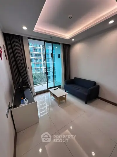 Modern living room with balcony view in high-rise apartment