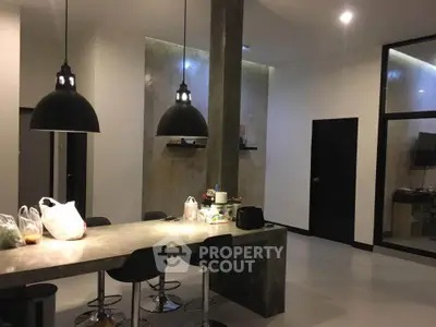 Modern kitchen with sleek design and stylish pendant lighting