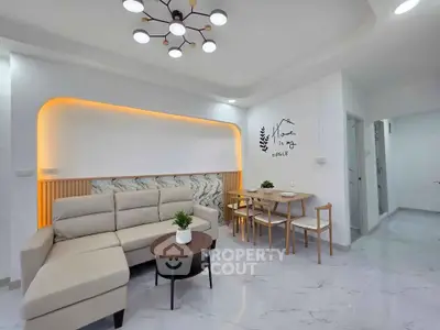 Modern living room with stylish lighting and elegant furniture in a cozy apartment.