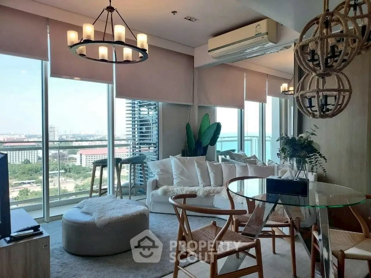 Modern living room with panoramic city view, stylish furniture, and elegant lighting.