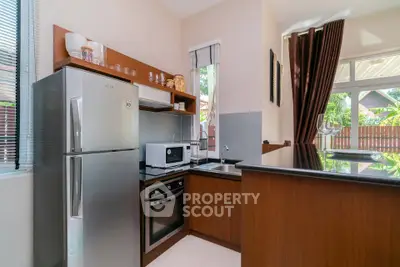 Modern kitchen with stainless steel appliances and open layout