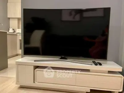 Modern living room with sleek TV and stylish furniture